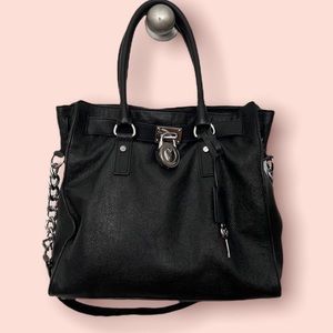 MICHAEL KORS black leather bag.
